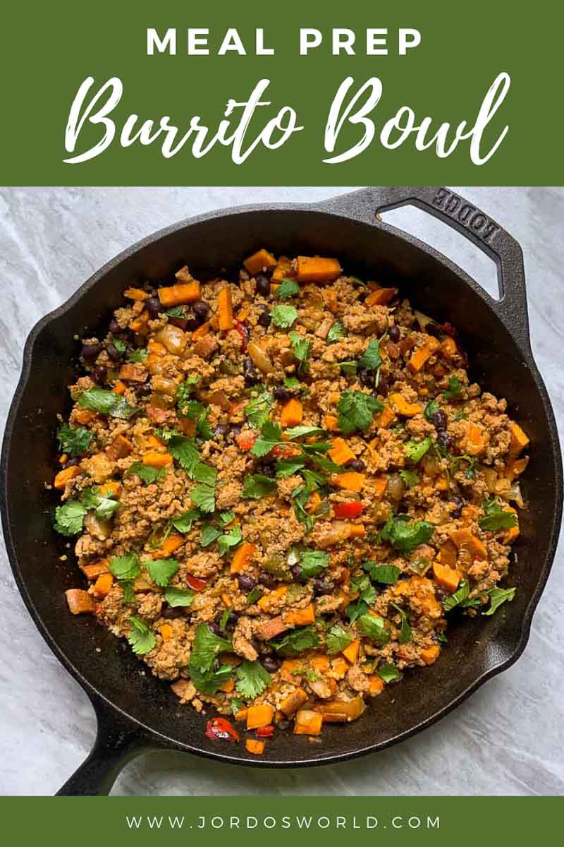 This is a pinterest pin for the meal prep burrito bowl recipe. There is a cast-iron skillet with the burrito bowl in it. The burrito bowl is ground turkey, sweet potatoes, black beans, peppers, onions, and cilantro all mixed together.