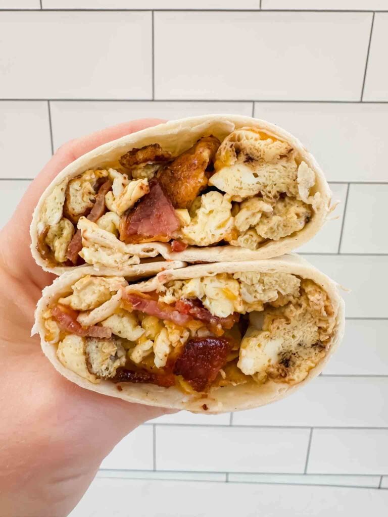 Close up cross section bacon breakfast burrito (recipe in post)