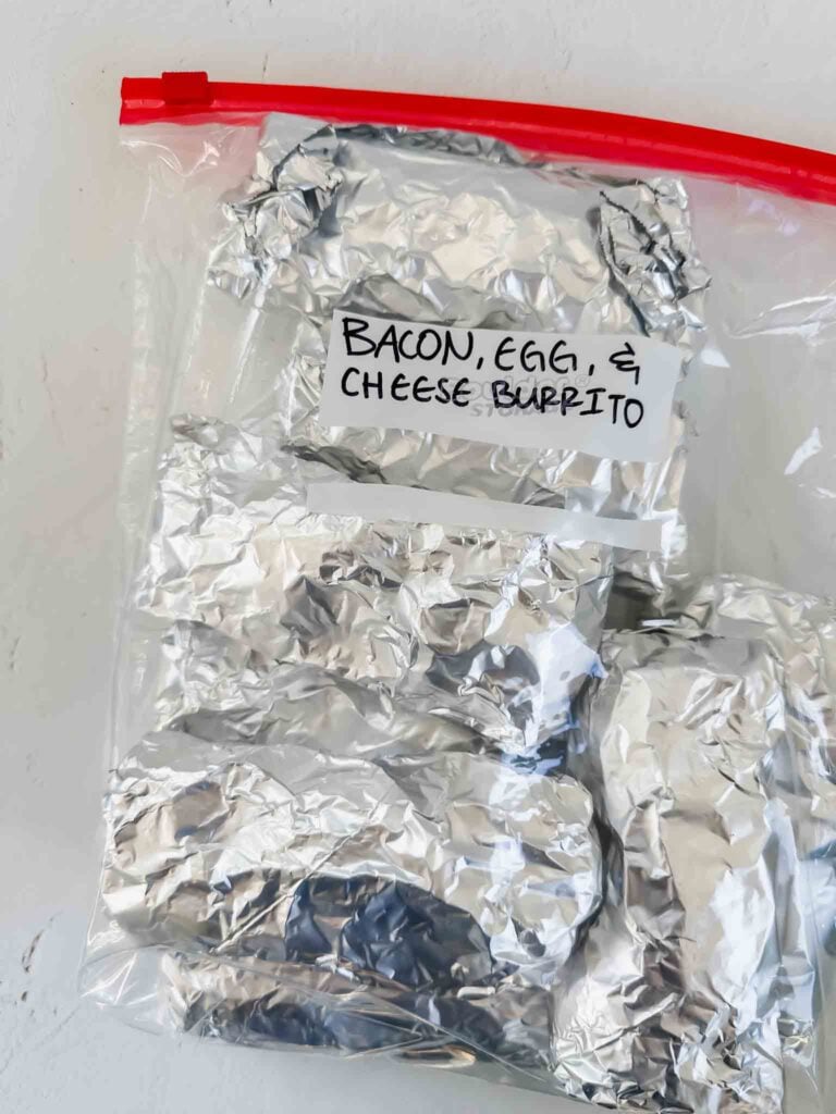 Back of bacon breakfast burritos in foil