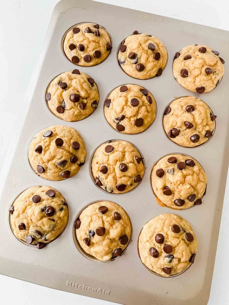 Overhead of muffin tin with pancake mix muffins