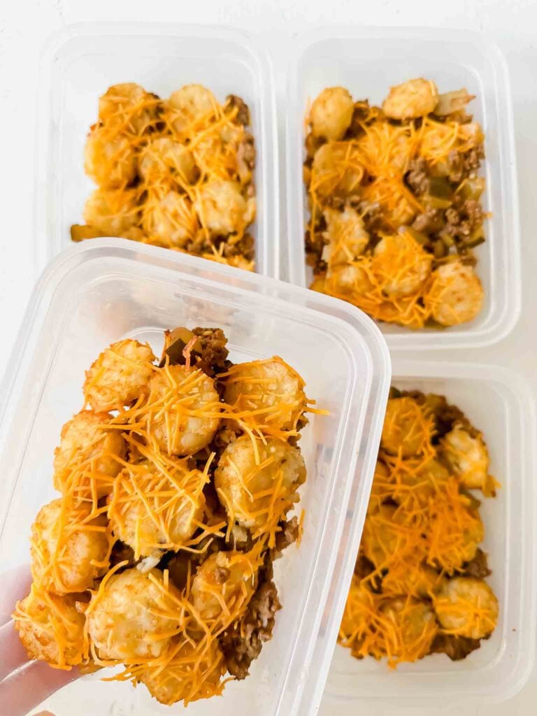 Meal prep containers with servings of cheeseburger tater tot casserole