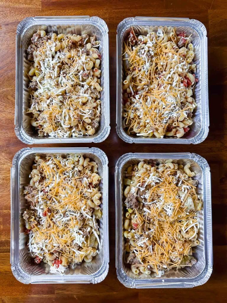 Dishes of pasta casserole prepared for freezer storage
