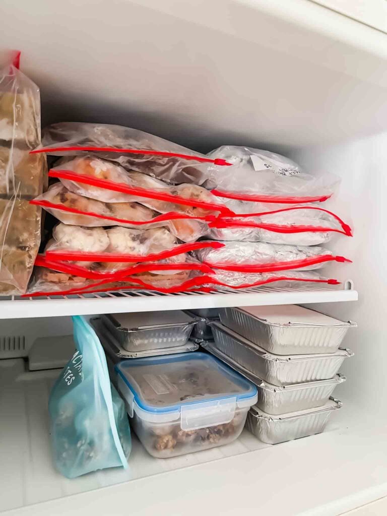 Freezer stocked with various frozen meal prep items