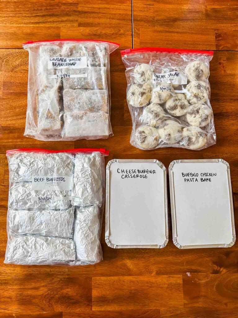 Table of meal prep items prepared for freezer