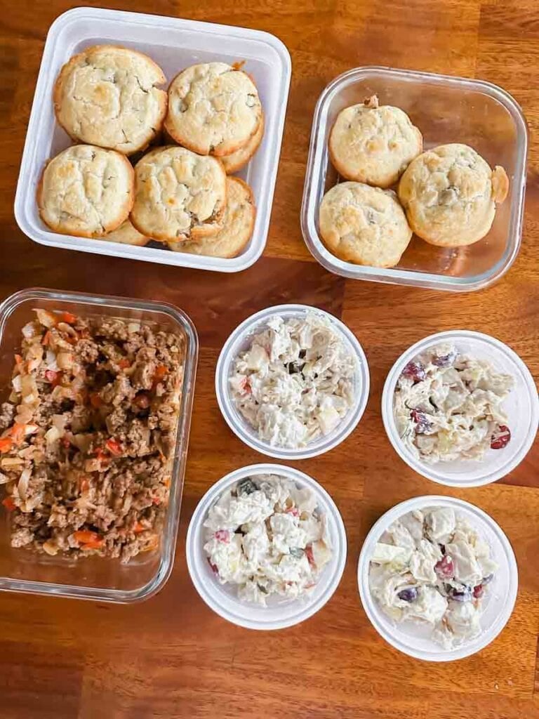 This is a picture of weekly meal prep 47. There's a container of sloppy joe mixture, 4 containers of chicken salad, and 2 containers of pancake sausage bites.