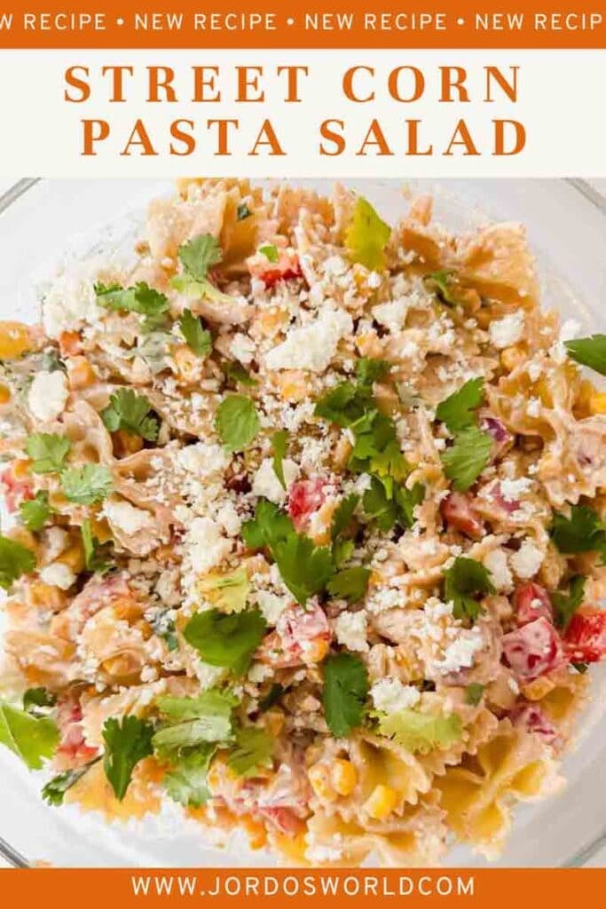 This is a pinterest pin of street corn pasta salad. There's a large bowl filled with the pasta salad of noodles, corn, peppers, cheese, sauce and topped with cilantro. The title of the recipe is above the picture.