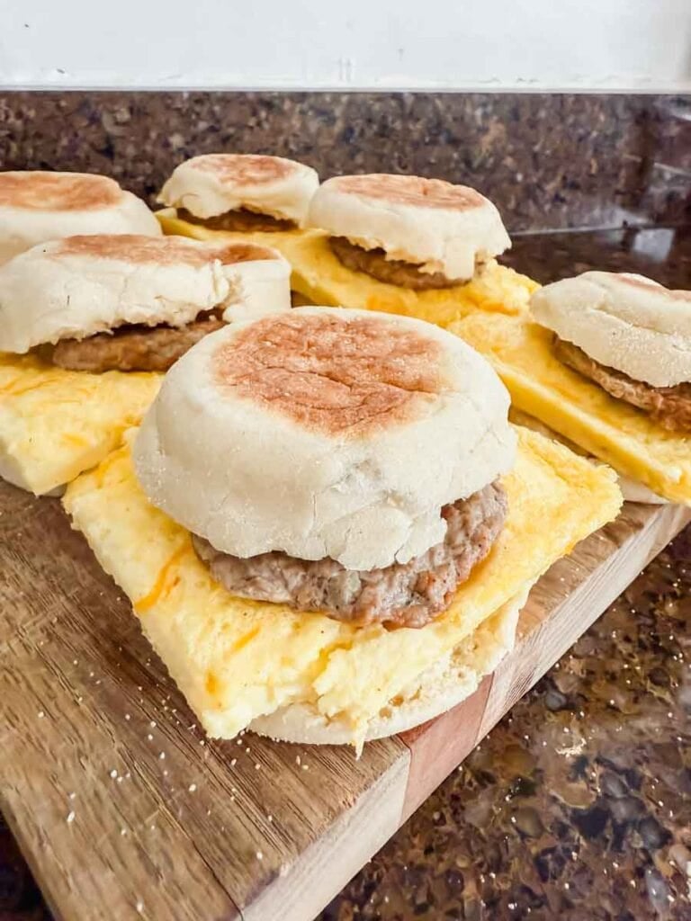 Soft breakfast sandwiches with sausage and eggs on English muffins with sausage and cheese, ready to serve.