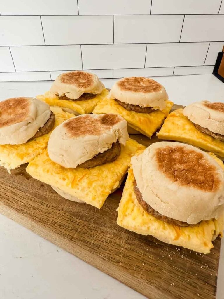 Soft breakfast sandwiches with sausage and eggs on English muffins with sausage and cheese, ready to serve.
