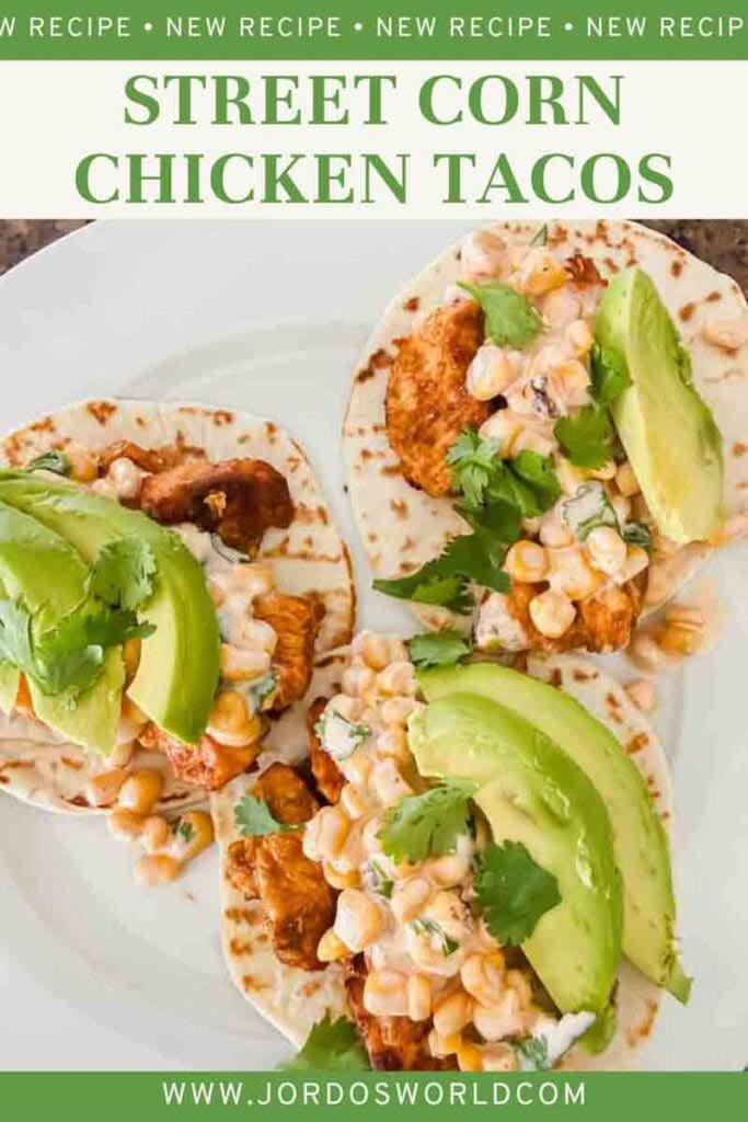 This is a pinterest image of street corn chicken tacos. There's a plate with tortillas, grilled chicken, street corn, and avocado. The title of the recipe is on the picture.